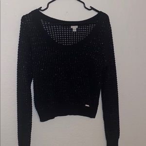 Black GUESS sweater.